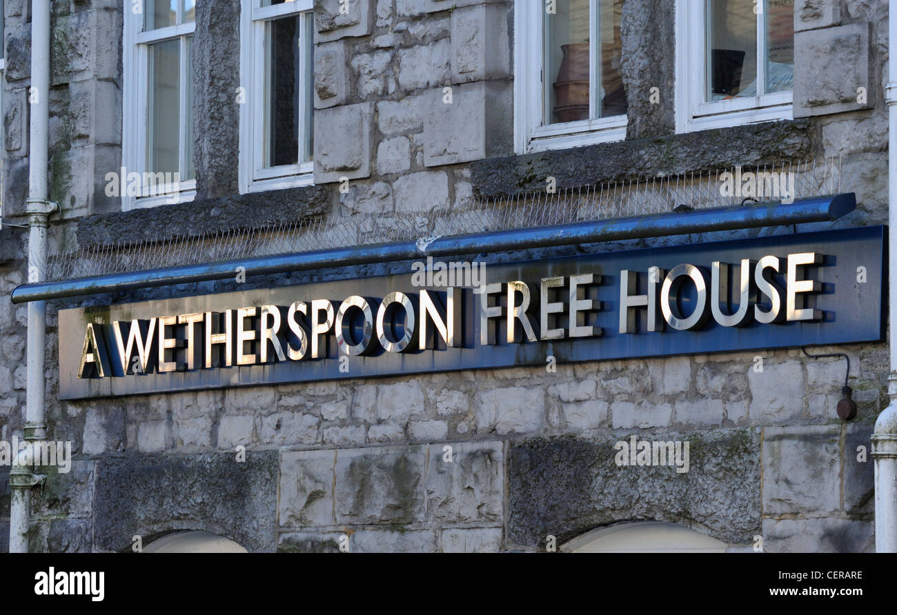 'A WETHERSPOON FREE HOUSE', sign on the Miles Thompson public house. All Hallows Lane, Kendal, Cumbria, England, United Kingdom. Stock Photo