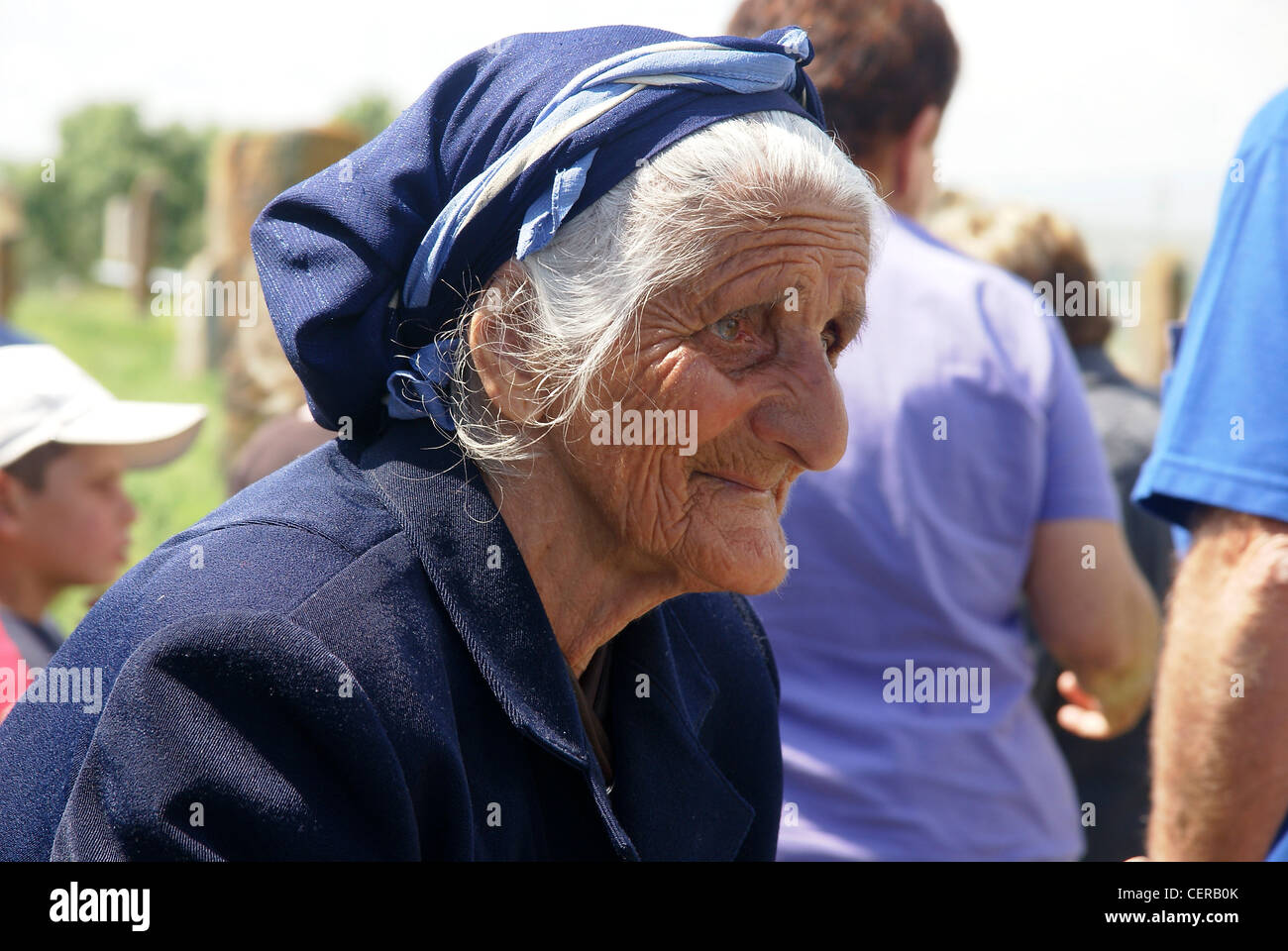Armenia, Lake Sevan, Noraduz cemetery Local woman sells souvenirs to tourists Stock Photo