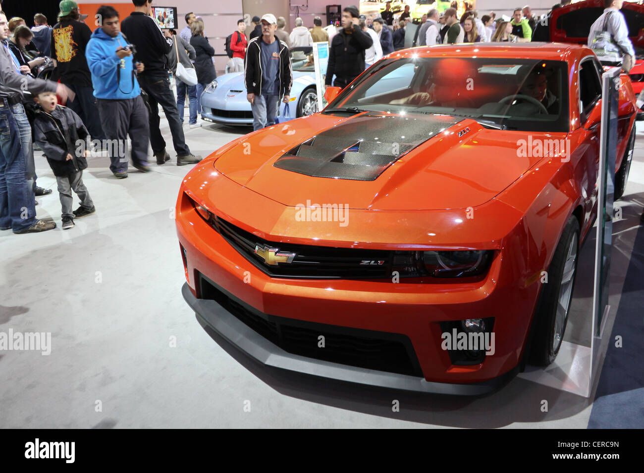 orange muscle fast powerful sports car people Stock Photo