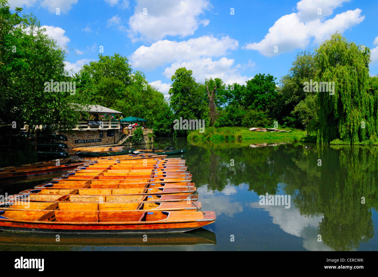 Boats and punts for hire on the Granta River outside The Granta Pub. Stock Photo