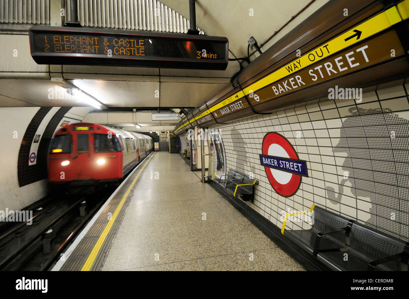 A tube train departing a platform on the Bakerloo line at Baker Street Underground Station. Stock Photo