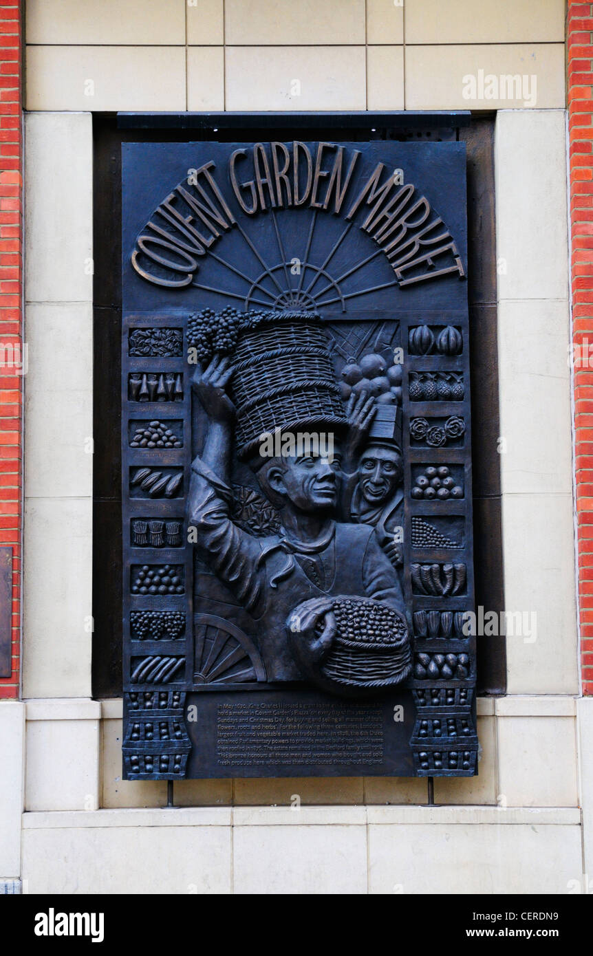 A bronze wall plaque in Covent Garden honouring all those who bought and sold fresh produce in the market since King Charles ll Stock Photo