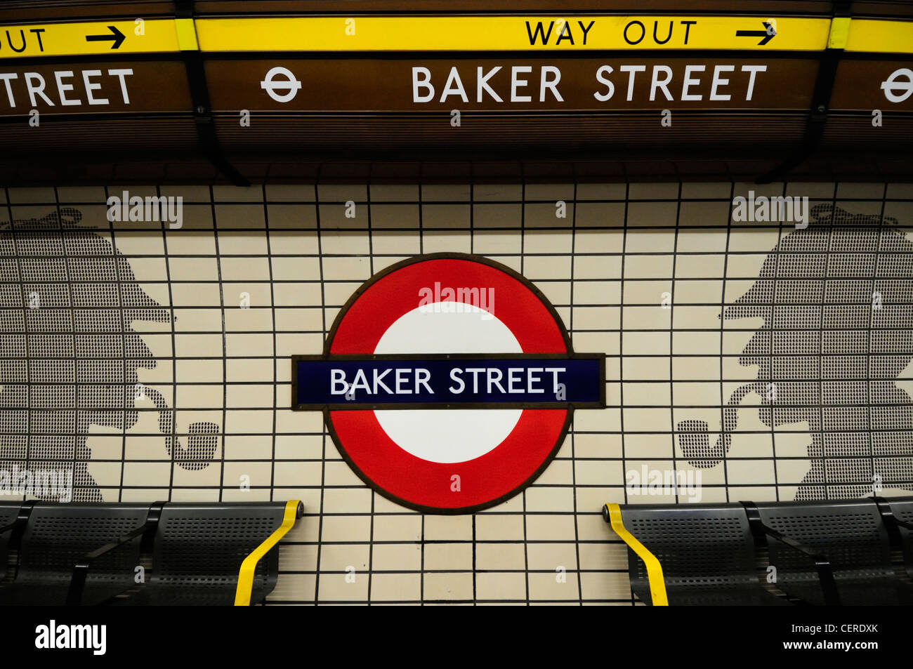 Baker Street Underground station sign on a tiled wall featuring the distinctive profile of Sherlock Holmes. Stock Photo