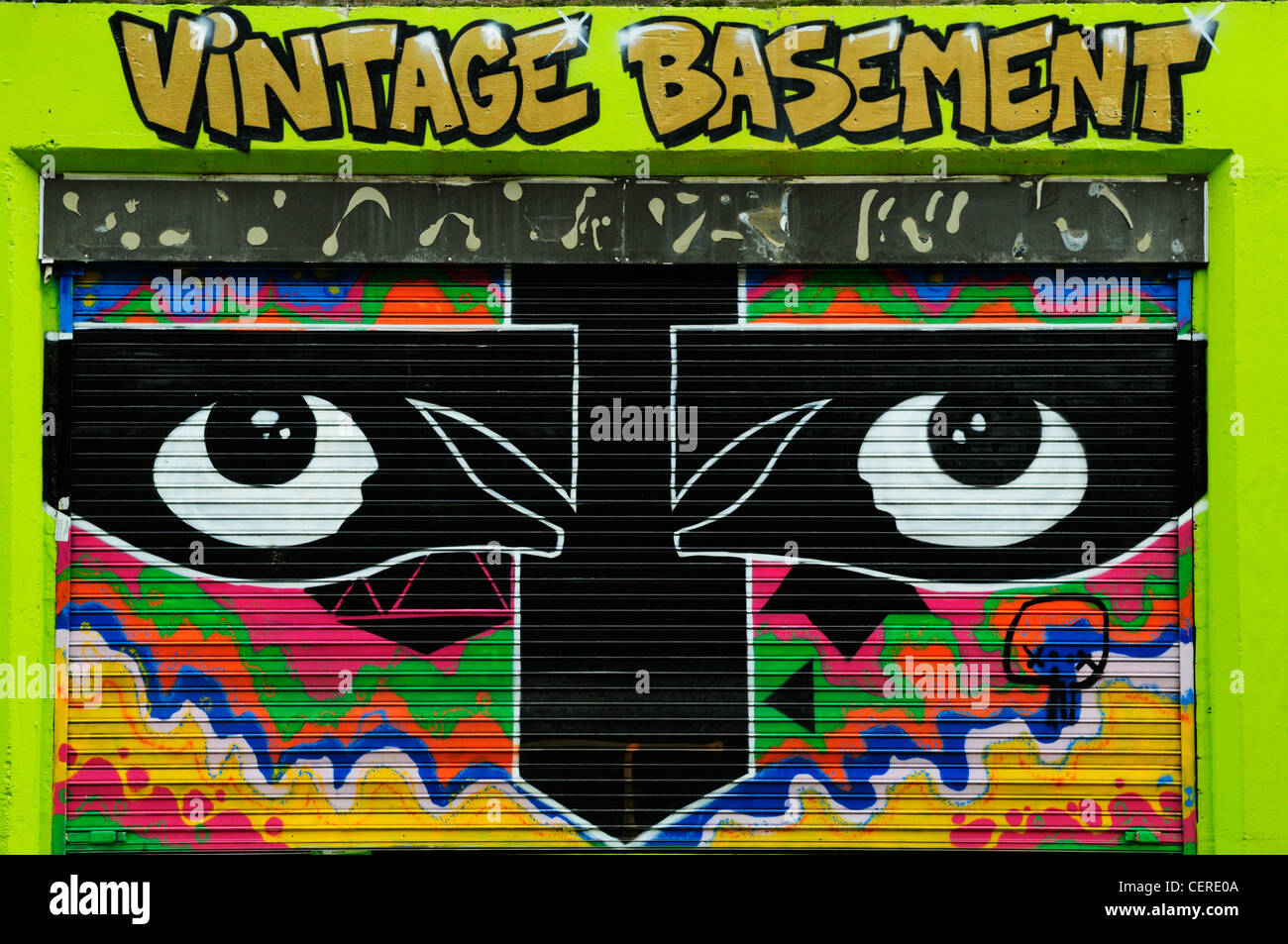 Graffiti on the shutter of Vintage Basement Shop in Brick Lane. Stock Photo