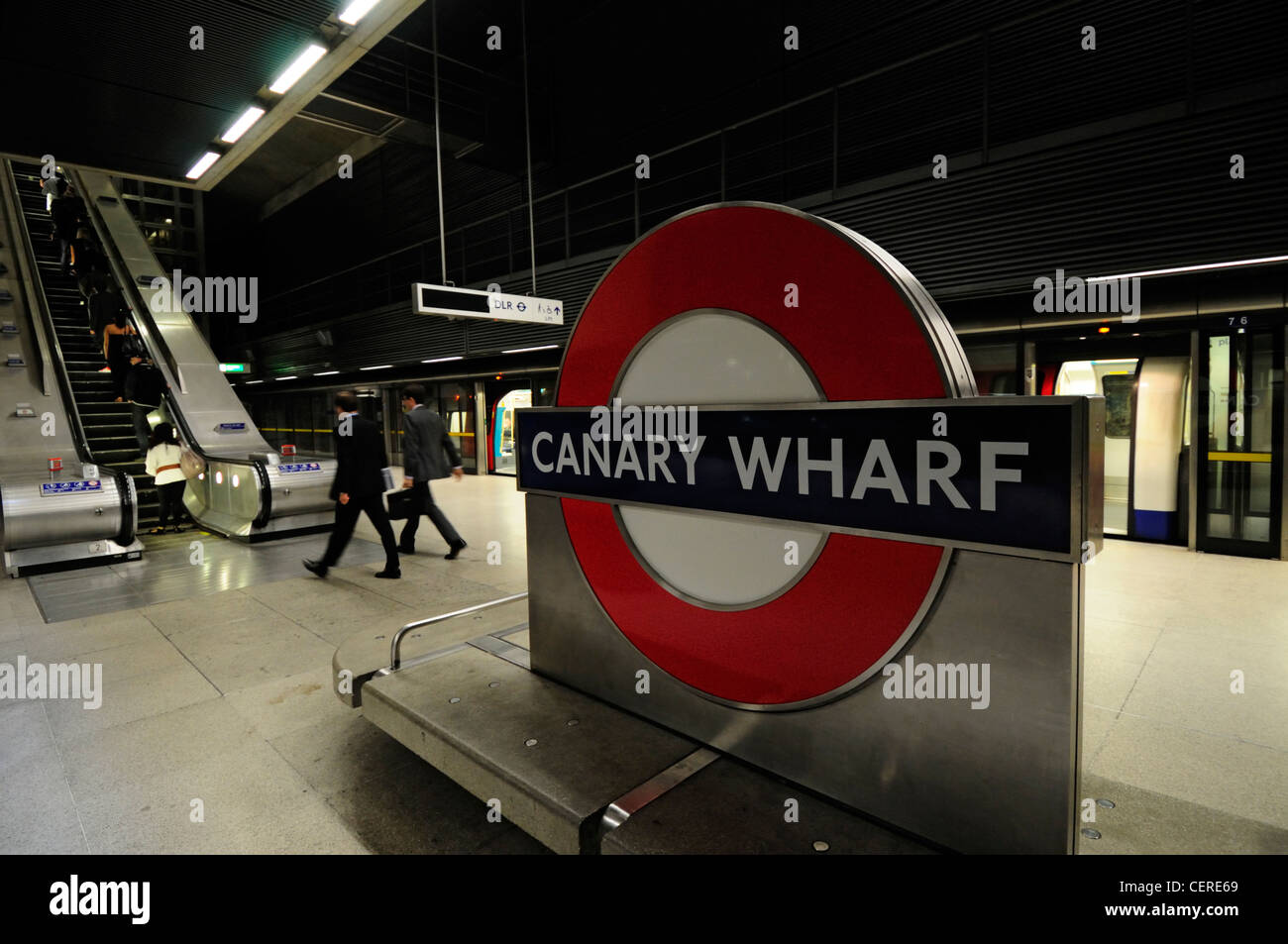 Passengers getting off a Jubilee line train at Canary Wharf Underground Station. Stock Photo