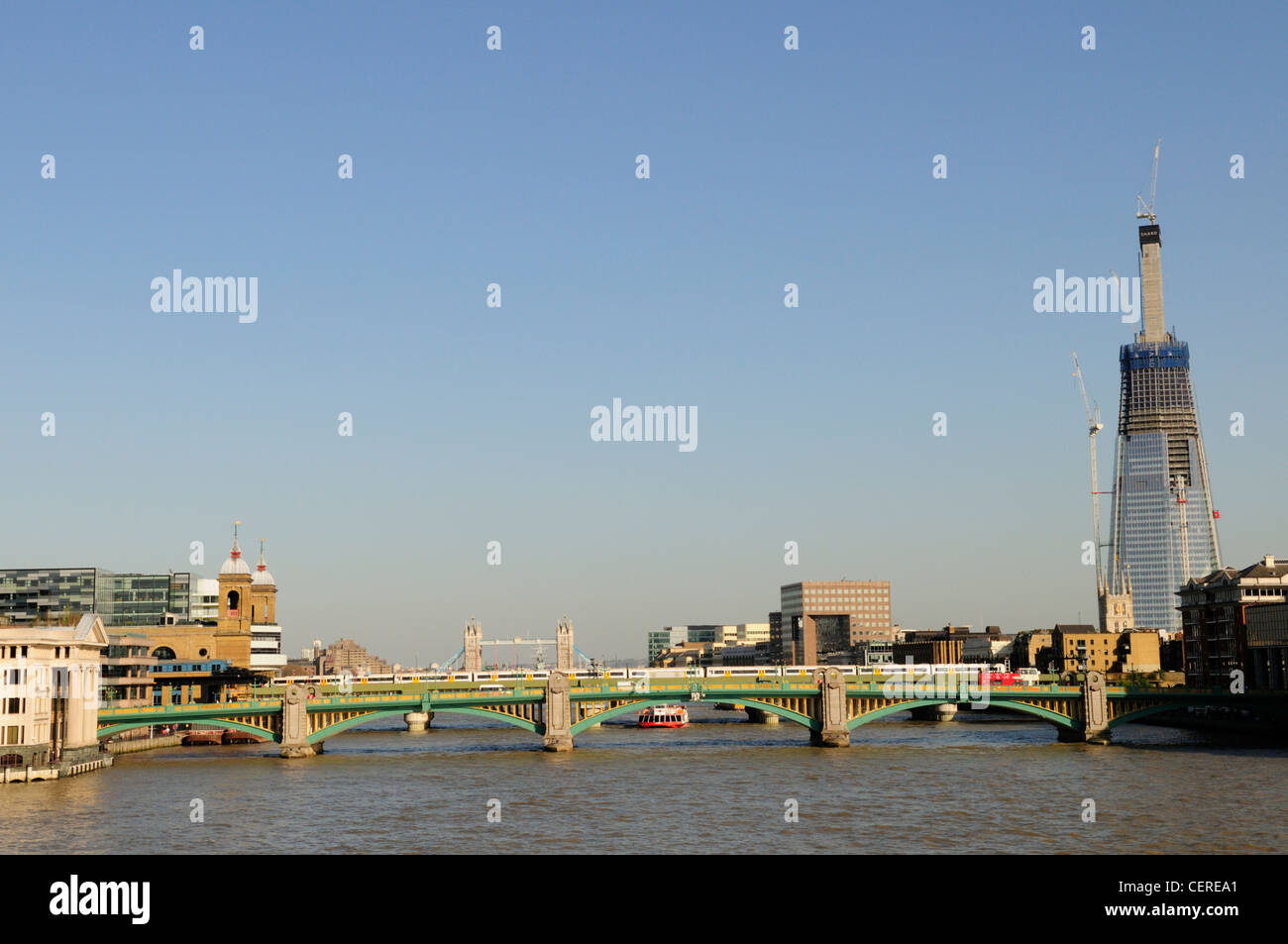 View along the River Thames towards Southwark Bridge and the Shard London Bridge. Stock Photo