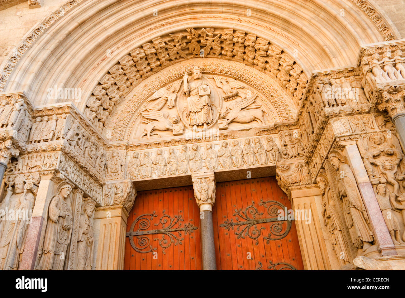 Ornate carvings 12th Century carvings around the door of the Cathedrale St-Trophime in Place de republique Arles France Stock Photo