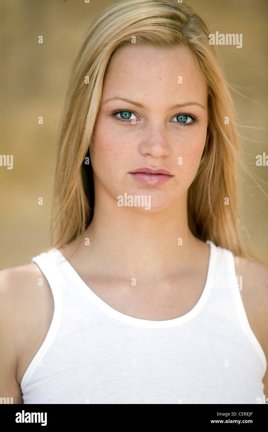 Female With Long Straight Blonde Hair And Blue Eyes Wearing A