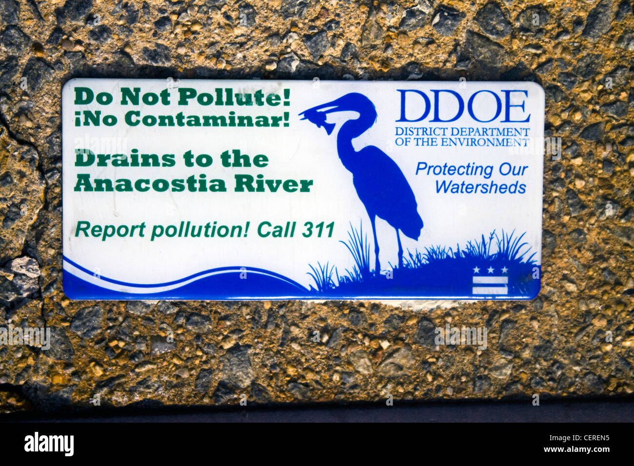 District of Columbia Department of the Environment Do Not Pollute Drains to Anacostia River sign on top of a storm drainage Stock Photo