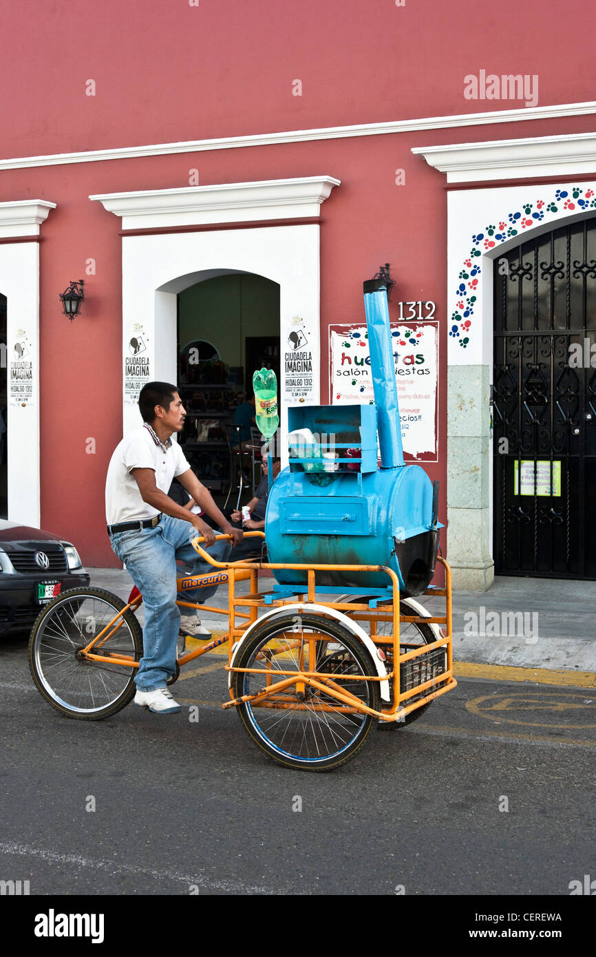 fried banana vendor pedals front loading tricycle with blue mobile wood  fired oven & shrieking steam whistle on Oaxaca street Stock Photo - Alamy
