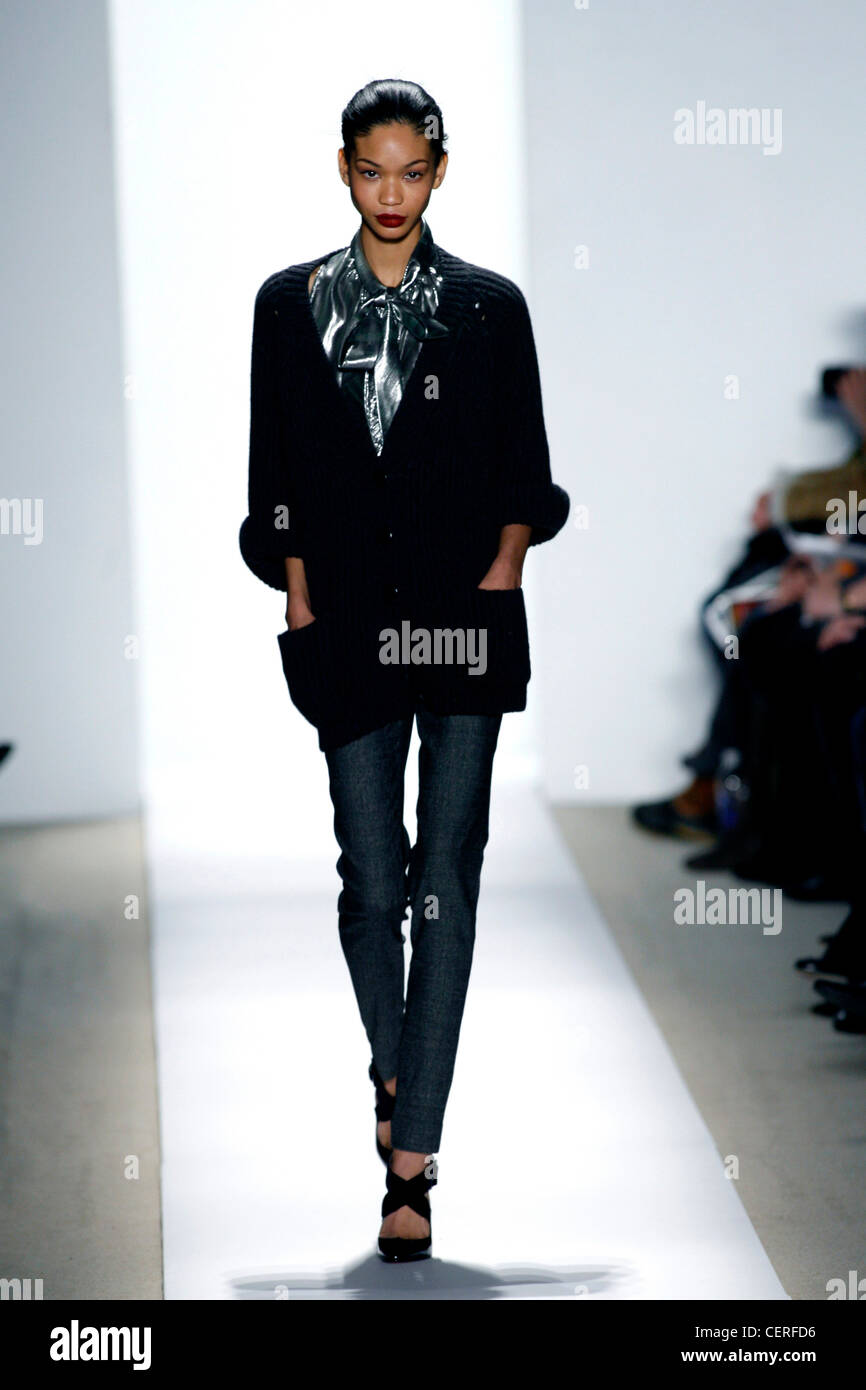 Peter Som New York Ready to Wear Autumn Winter Model Chanel Iman black hair  off face wearing silver blouse bow at neck under Stock Photo - Alamy