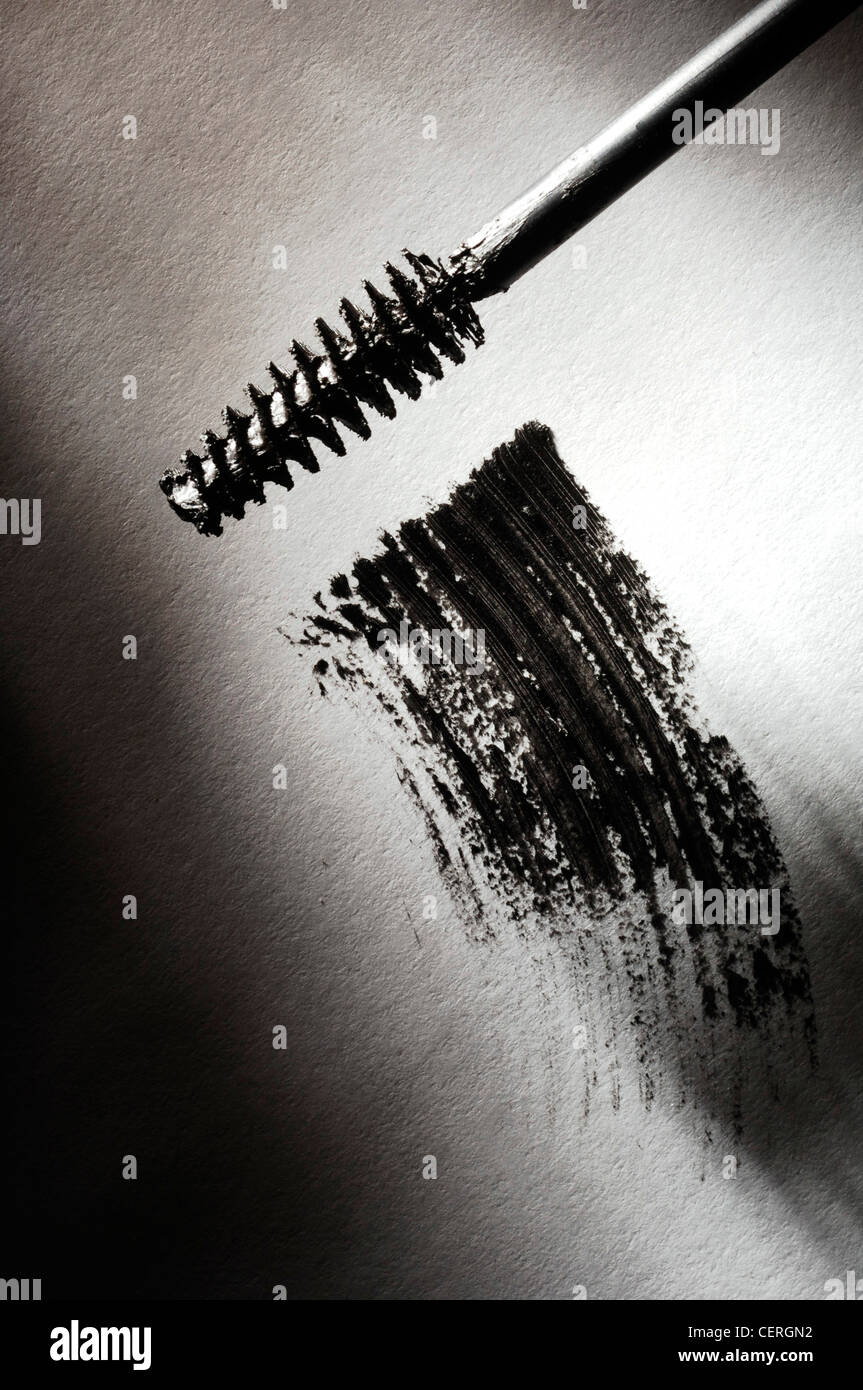 Mascara wand and smudge of black mascara Stock Photo Alamy