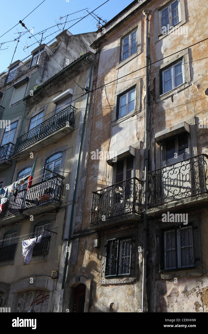Old run down housing apartment block flats, central Lisbon, Portugal Stock Photo