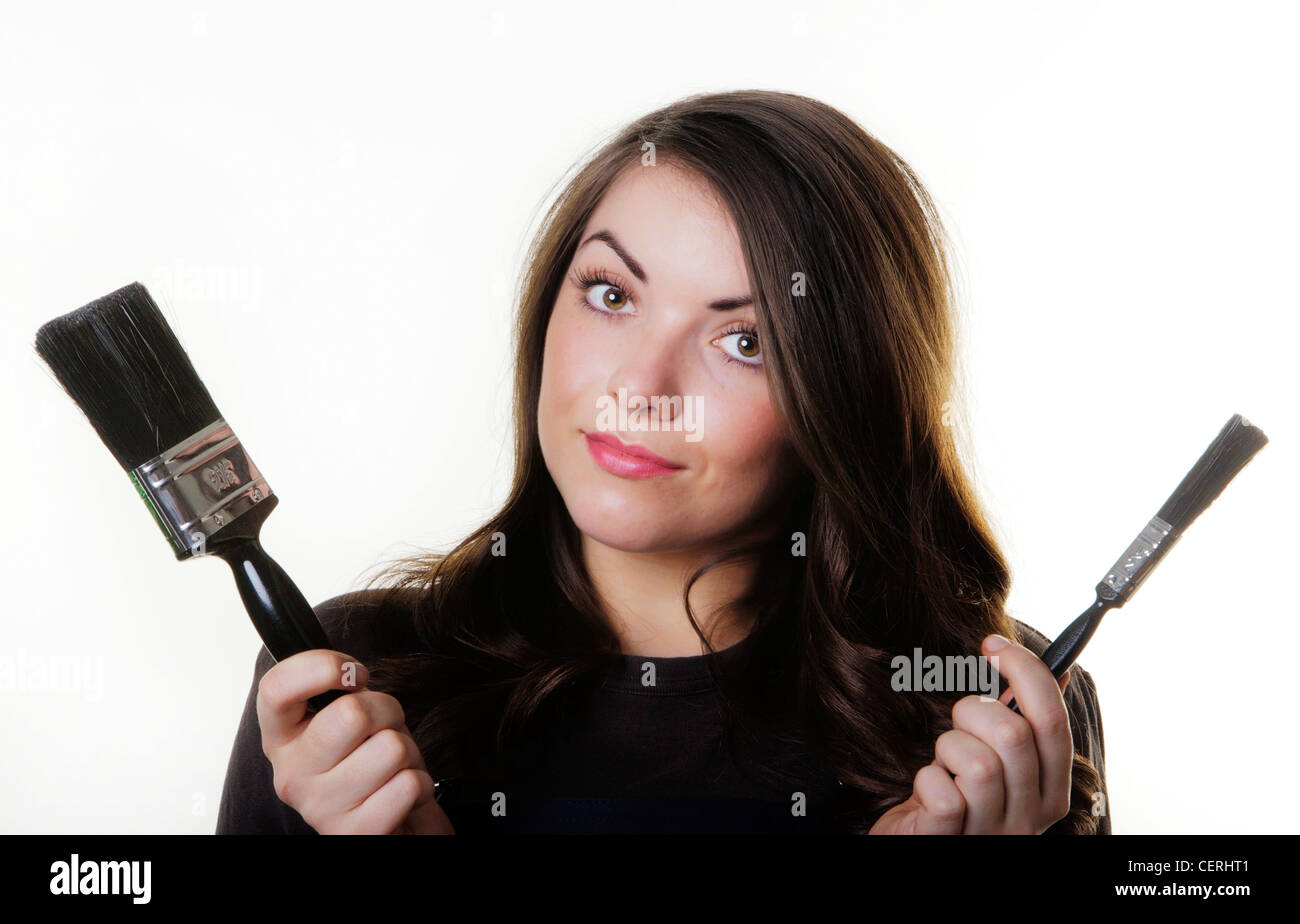 young woman with paint brush in hand Stock Photo Alamy