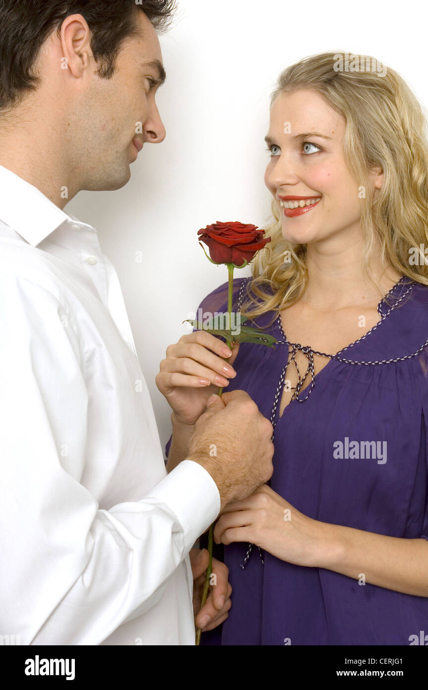 Female Curly Blonde Hair Wearing Purple Smock Top Male Short