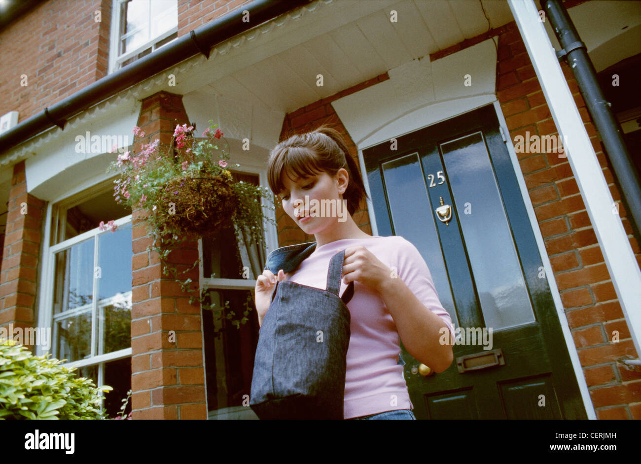 Woman wearing pink top jeans hi-res stock photography and images - Alamy