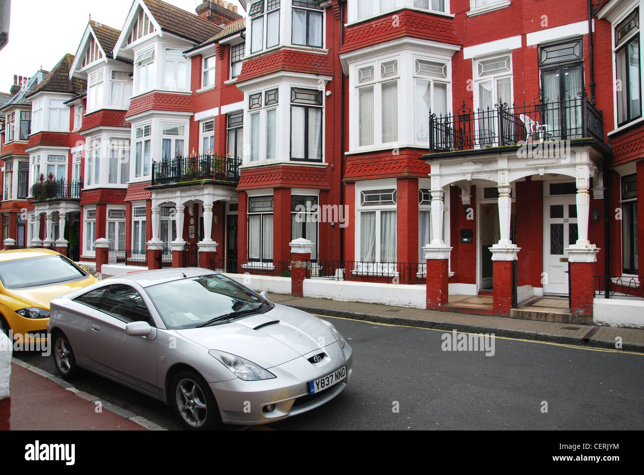 suburban street with terraced houses Eastbourne UK Stock Photo