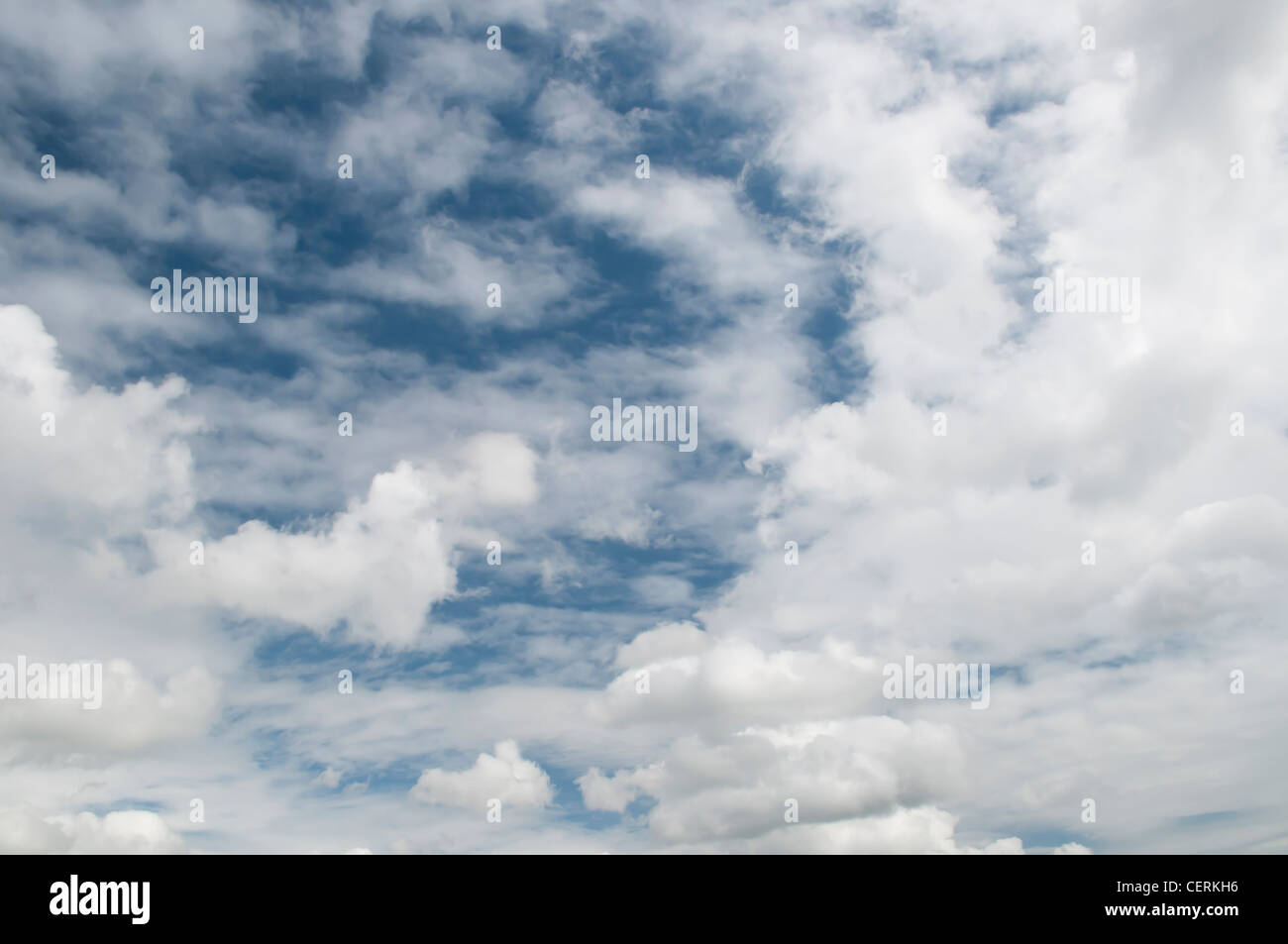 Blue sky with fluffy white clouds Stock Photo - Alamy