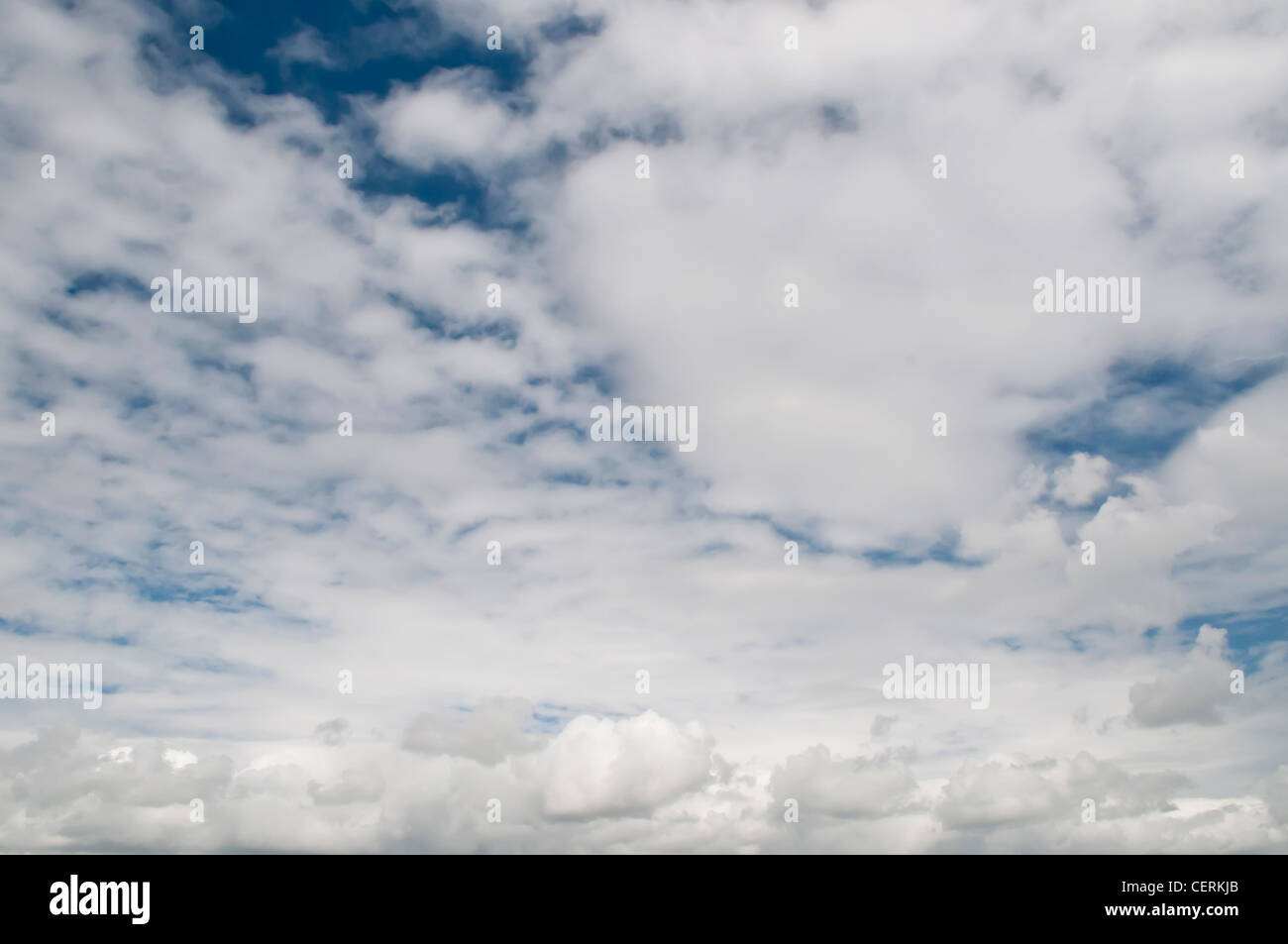 Blue sky with fluffy white clouds Stock Photo