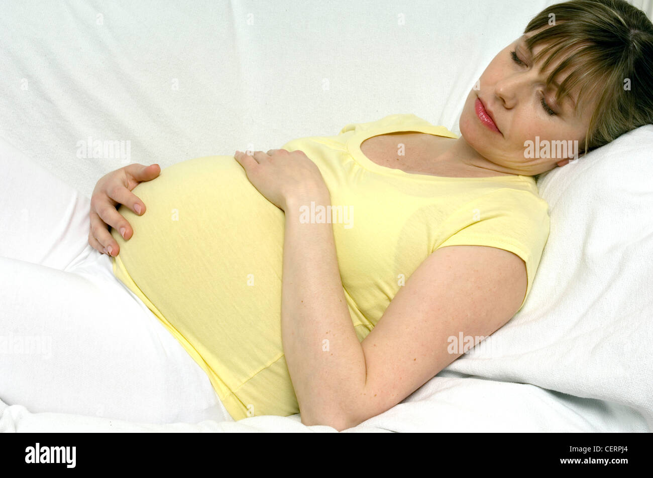 Pregnant  Female lying down Stock Photo