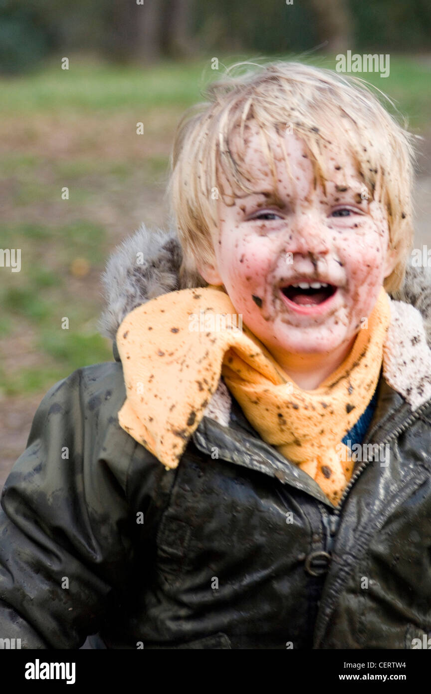 A male child with mud splattered over his face Stock Photo Alamy