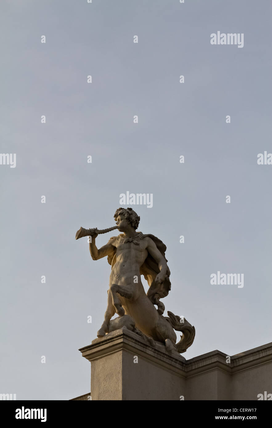 A minotaur sculpture indicating to play a trumpet-like instrument on Vienna's burgtheater Stock Photo