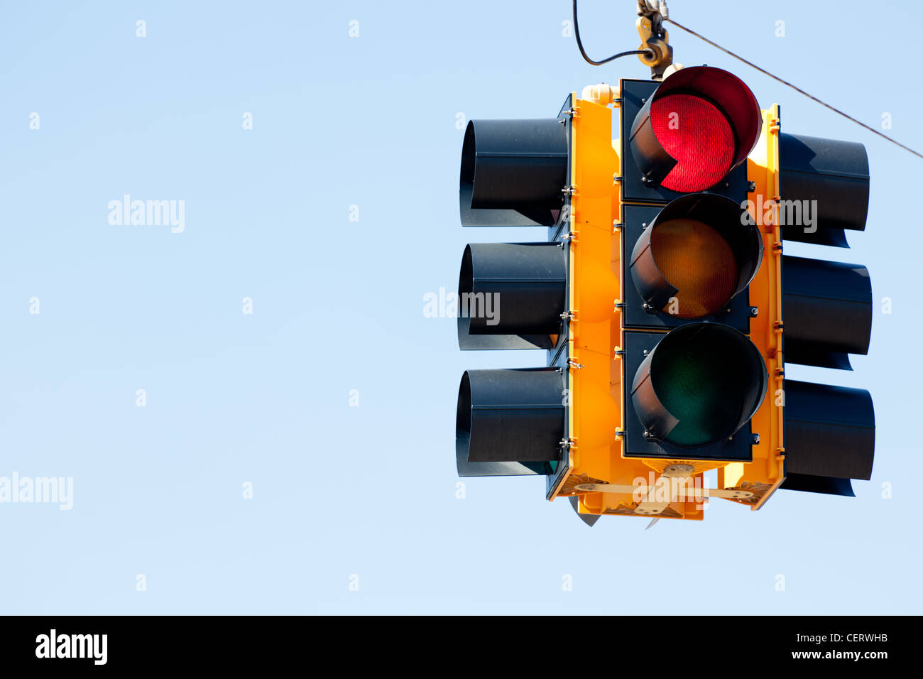 Red Traffic Light in front of blue sky Stock Photo