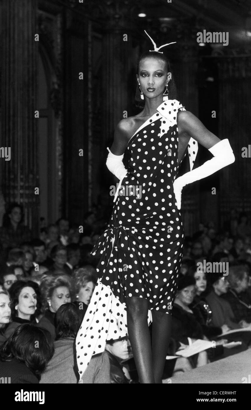 Yves Saint Laurent Spring Summer Model Iman wearing a black and white polka dot off the shoulder dress long white gloves Loomis Stock Photo