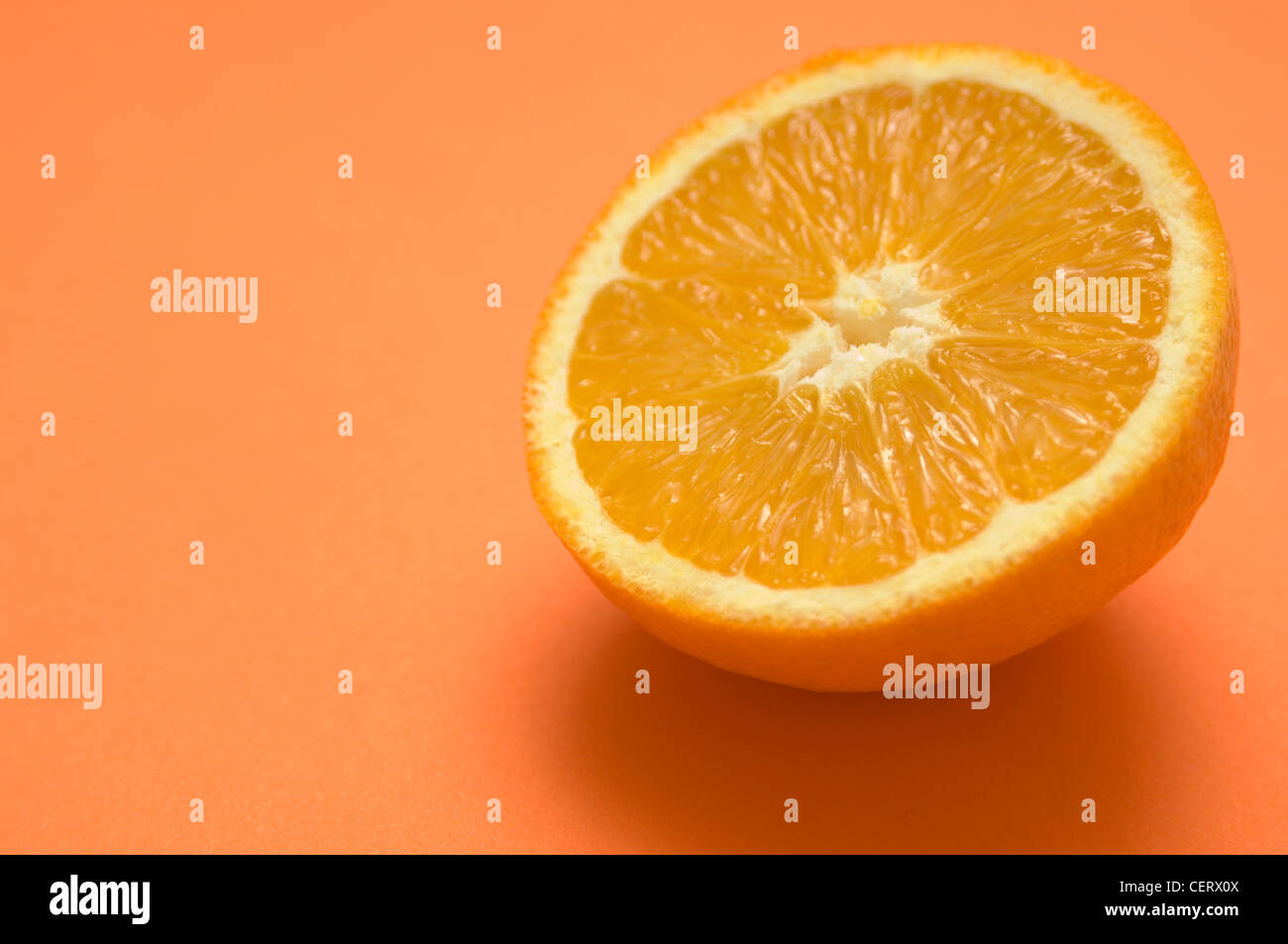 An orange on an orange background Stock Photo