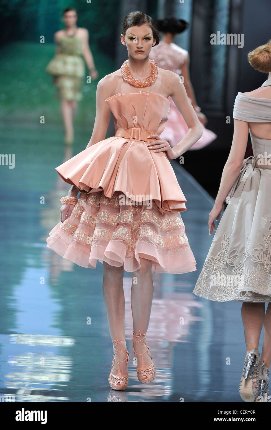 Christian Dior Paris Haute Couture Autumn Winter Model wearing pink  sleeveless dress, gathered skirt and top, belted waist Stock Photo - Alamy