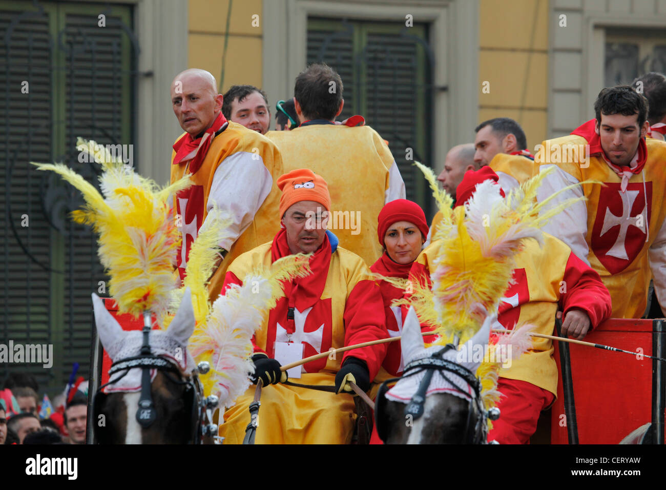 One of the carriages passing by cheering crowds before the Battle of Oranges (Battaglia delle arance) at Ivrea Carnival Stock Photo