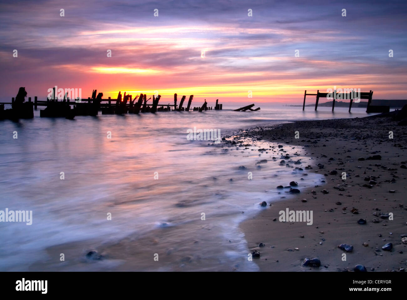 The wooden sea defences and rocks which have been placed on Happisburgh ...