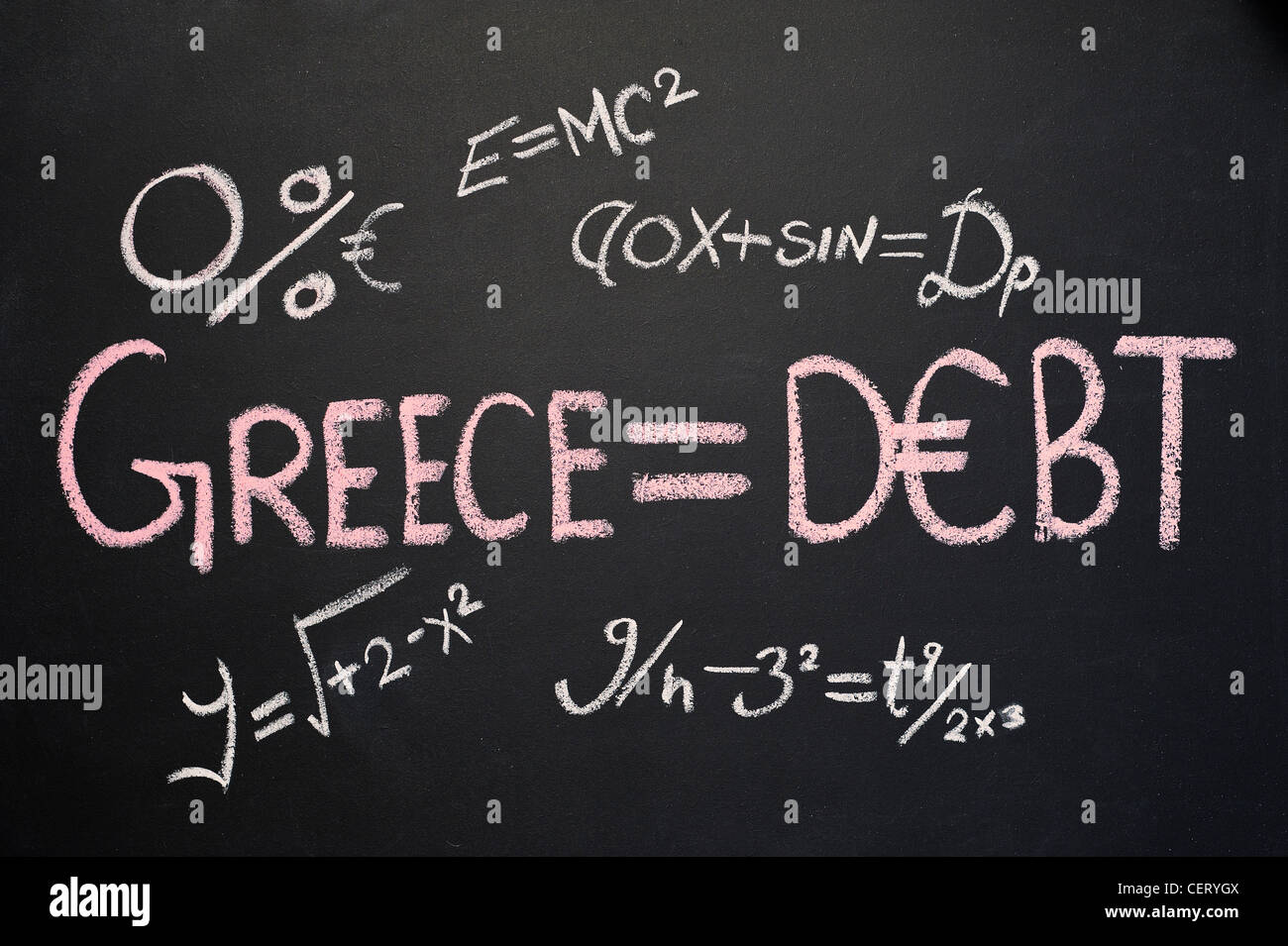 Blackboard with GREECE = DEBT written on it in chalk and various other equations Stock Photo