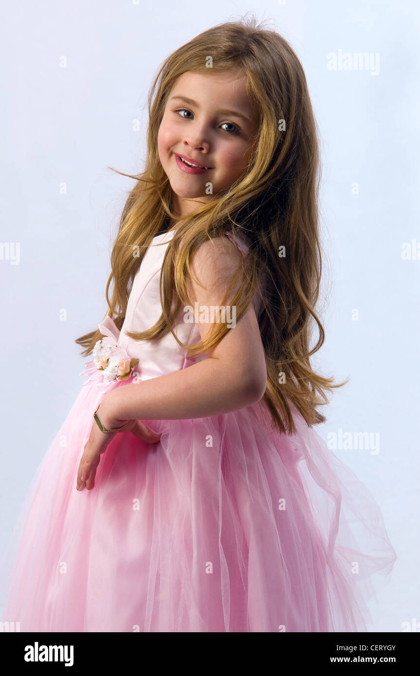 young girl on a pink background in the studio Stock Photo - Alamy