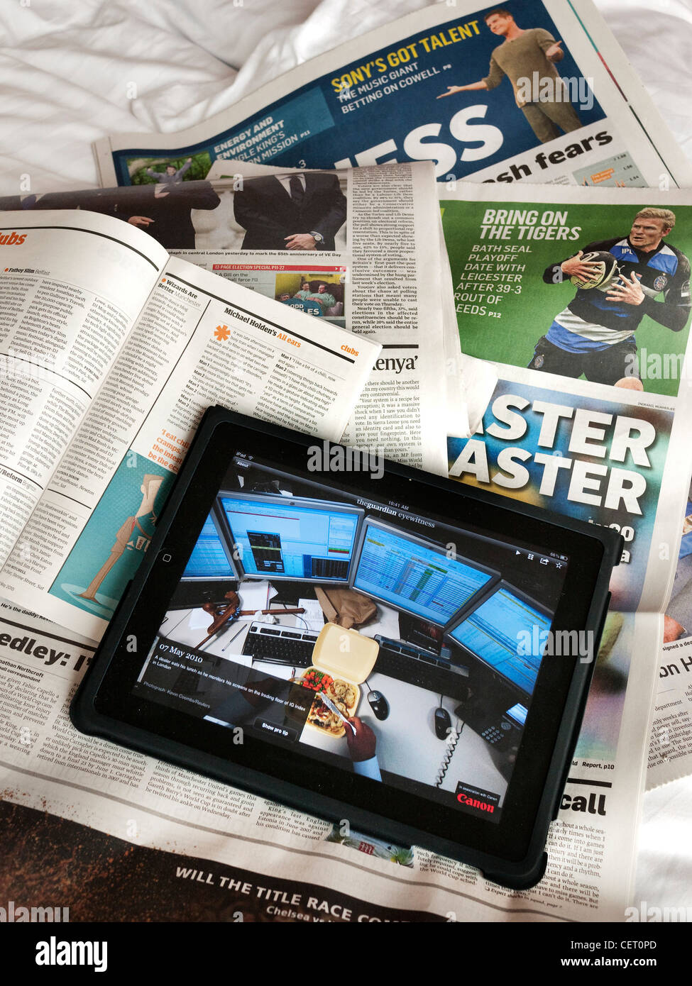 Apple iPad with sunday papers Stock Photo