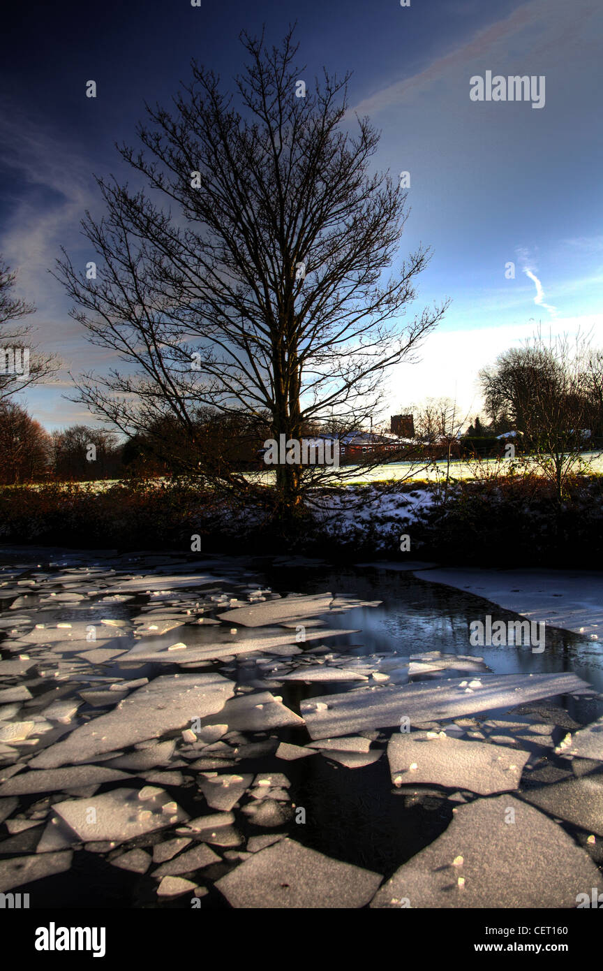 Ice on the Bridgewater canal winter in Grappenhall Warrington Cheshire, UK Stock Photo