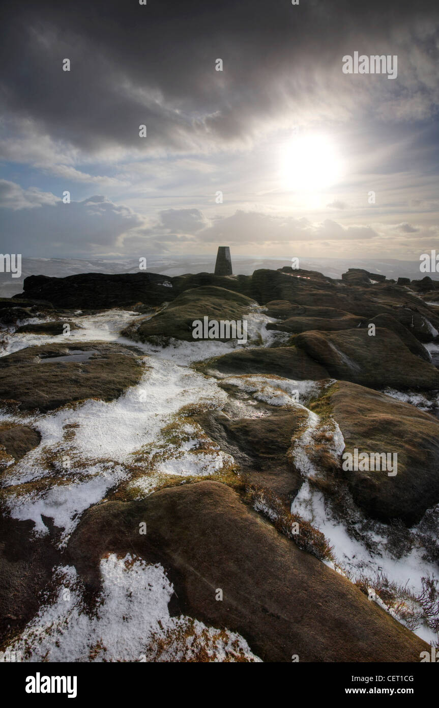 Stanage Edge Trig point following a snow storm in the Peak District. Stock Photo