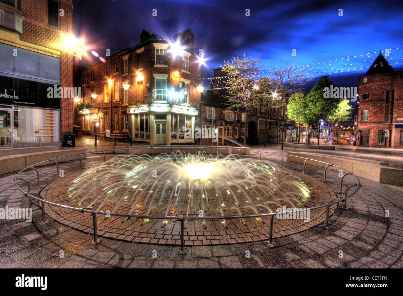 Bridge St / Hatters Row Fountain Opposite The Blue Bell Pub, Horse Market Street, Warrington at dusk, Cheshire, England WA1 1TS Stock Photo