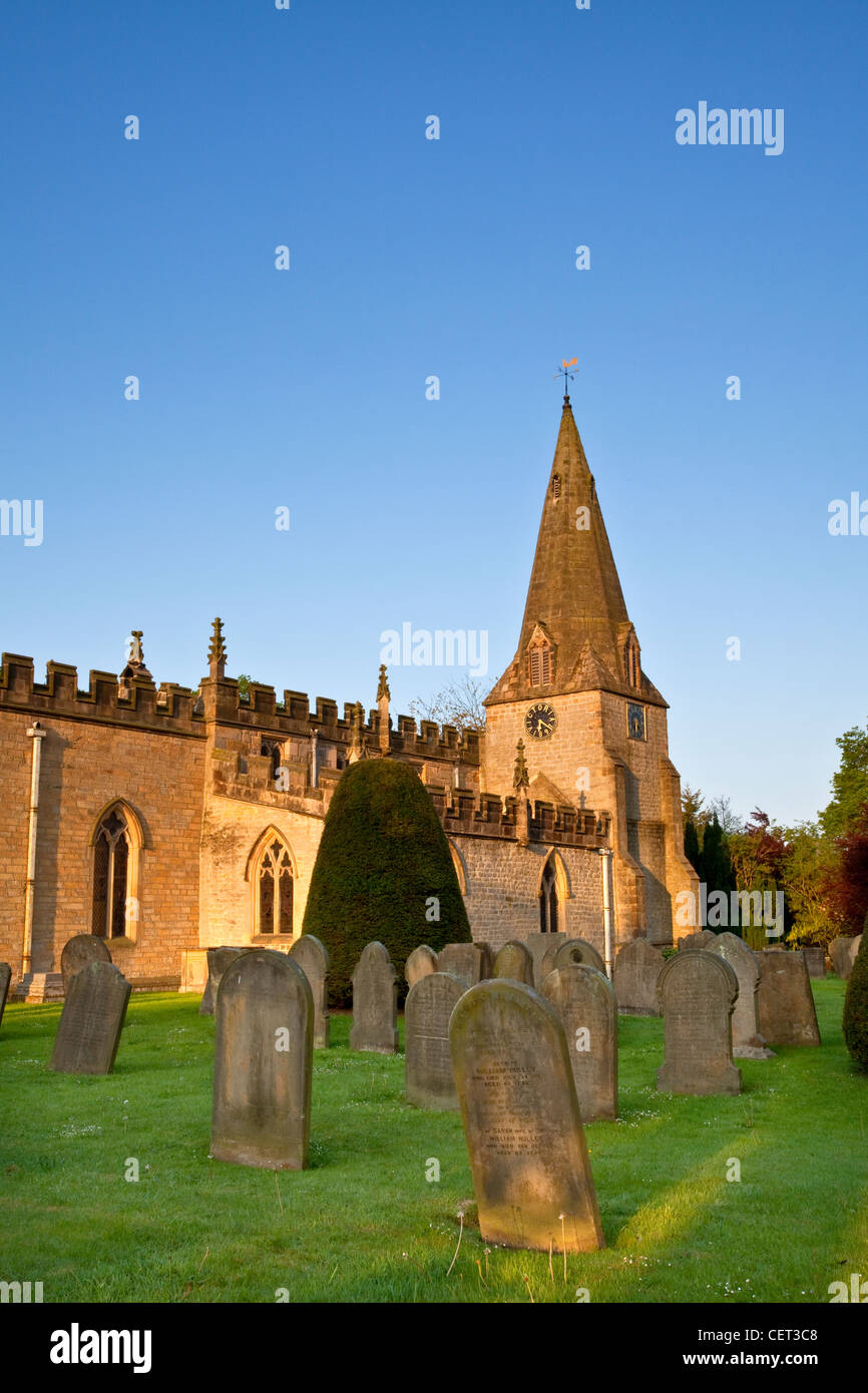 First light over the parish church of St Anne in Baslow. The clock face ...
