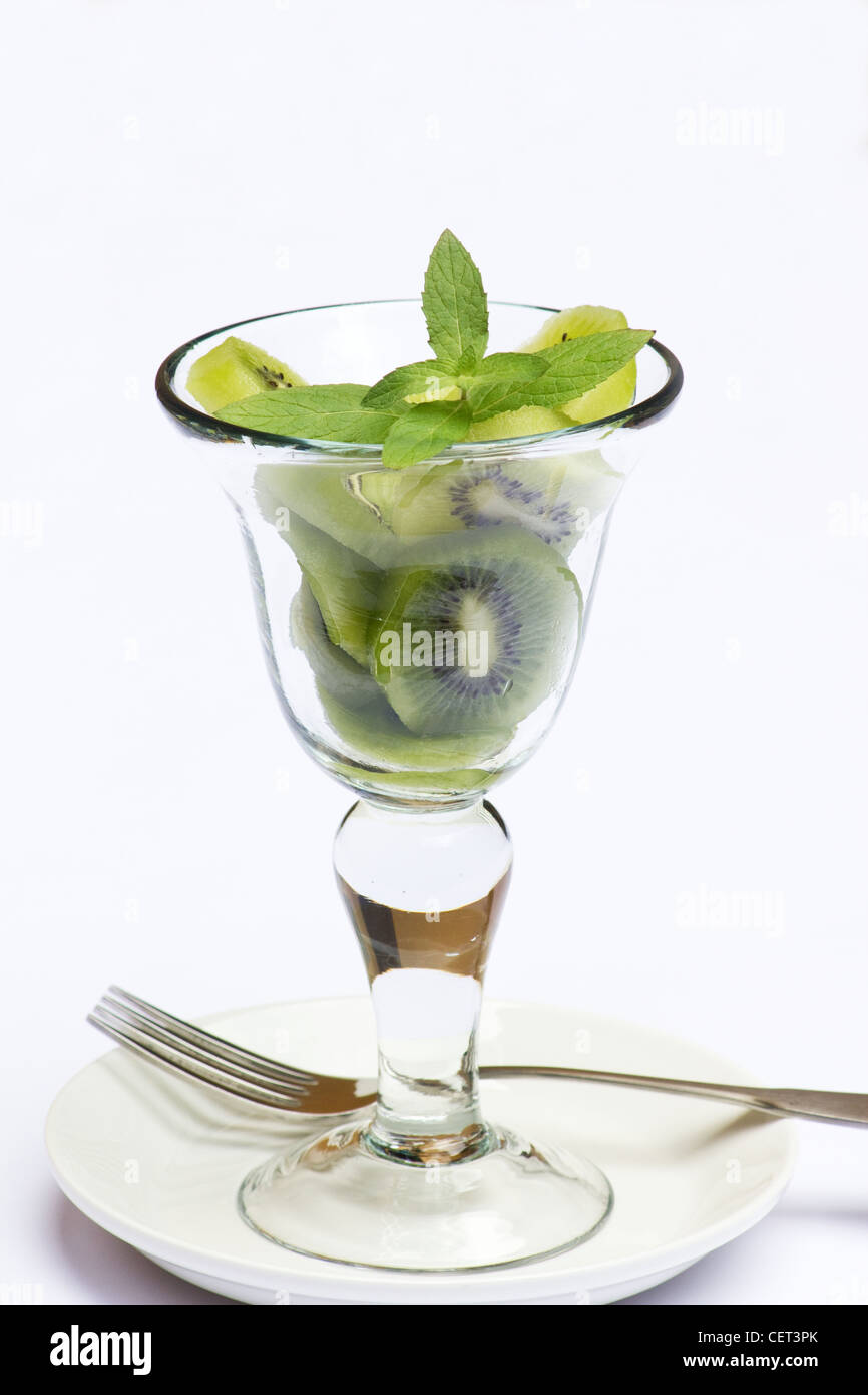 Kiwi slices and sprig of mint in a glass. Stock Photo