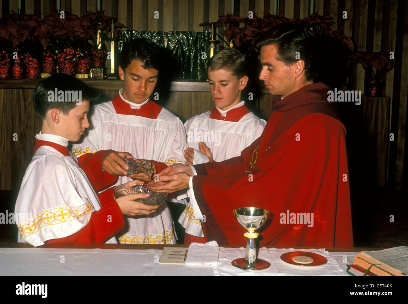Roman Catholic priest, altar boys, preparation of the gifts, Eucharistic Prayer, church service, mass, Novato, California Stock Photo
