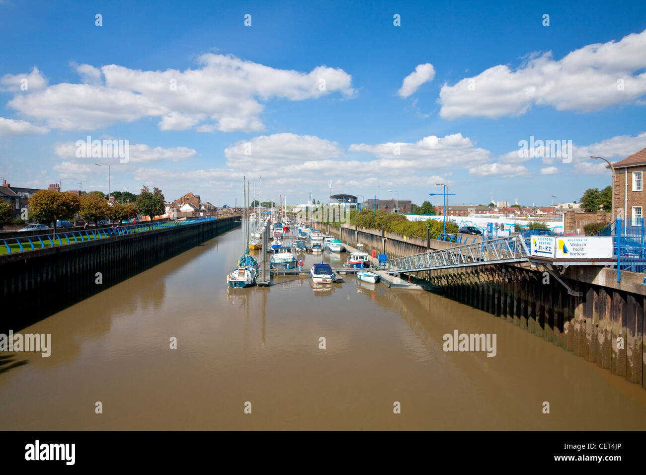 Boats moored by jetties in the Wisbech Yacht Harbour on the River Nene. Stock Photo