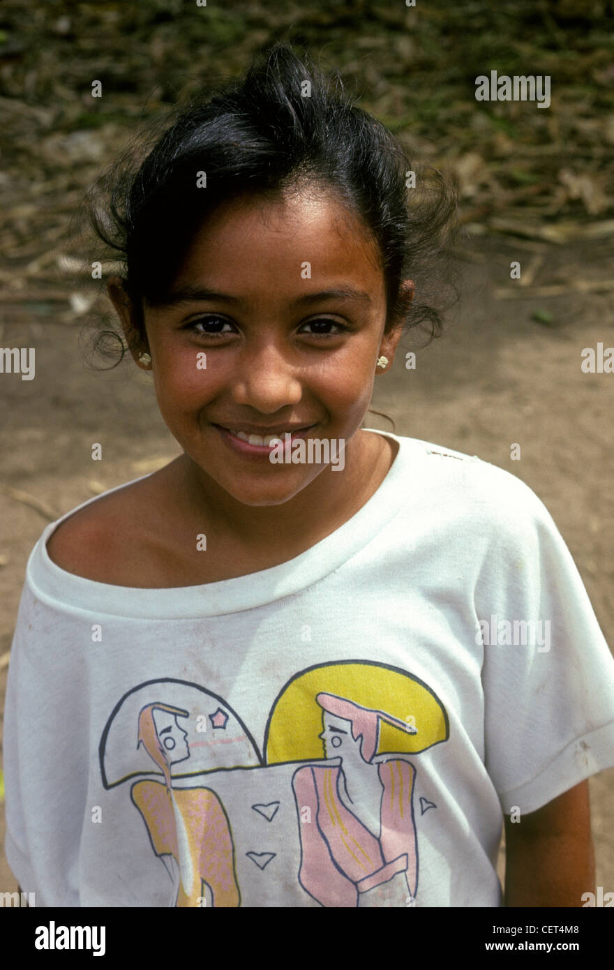 1 one Mexican girl looking at camera, female child, eye contact, front view, portrait, village of Ixtapa, Ixtapa, Jalisco State, Mexico Stock Photo