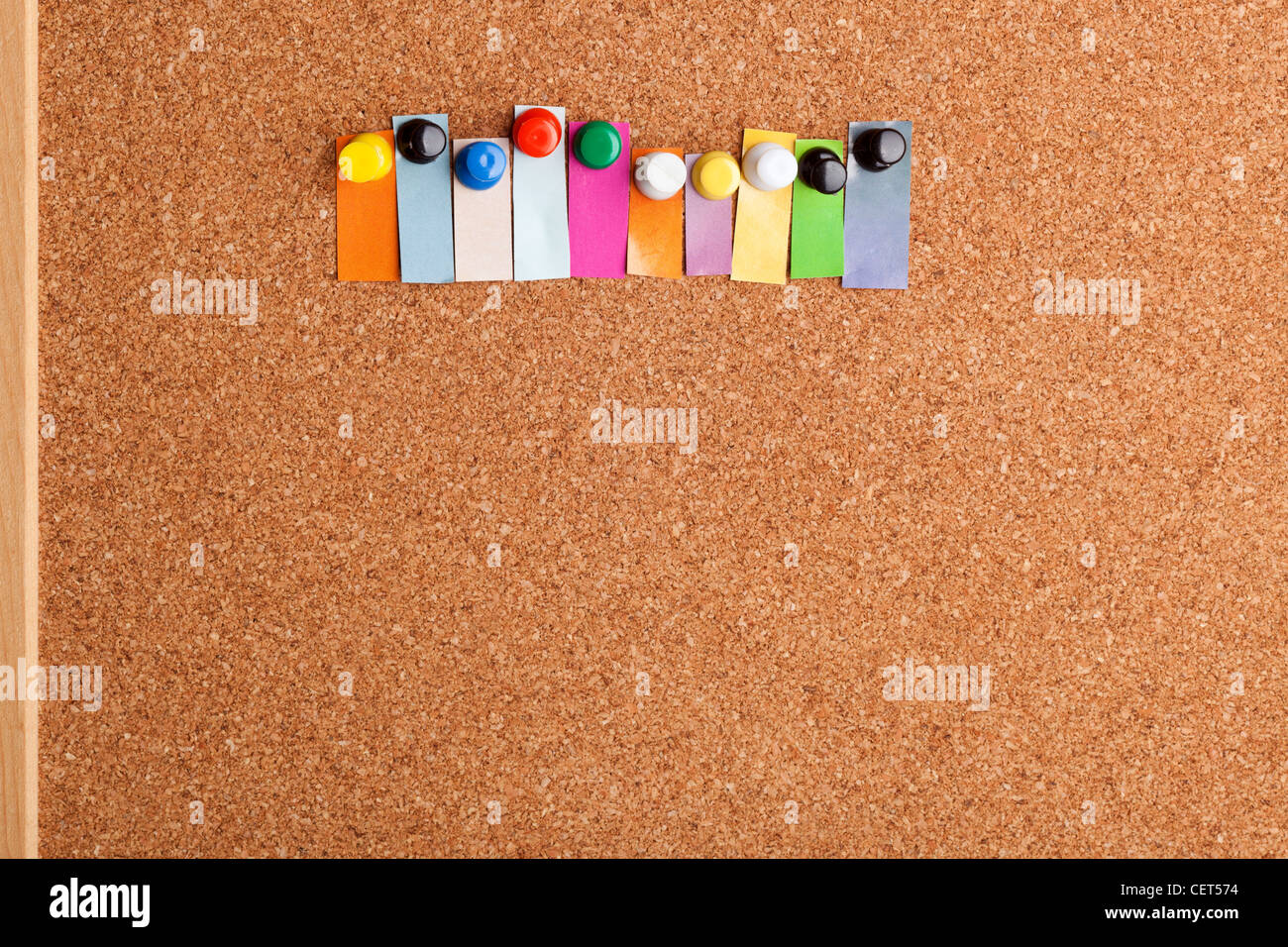 Cork board and colorful heading with copyspace for a ten letter word Stock Photo