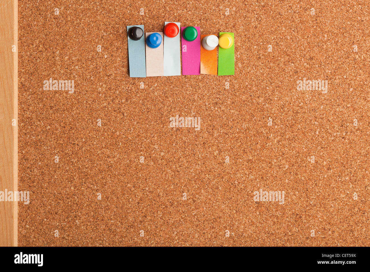 Cork board and colorful heading with copyspace for a six letter word Stock Photo
