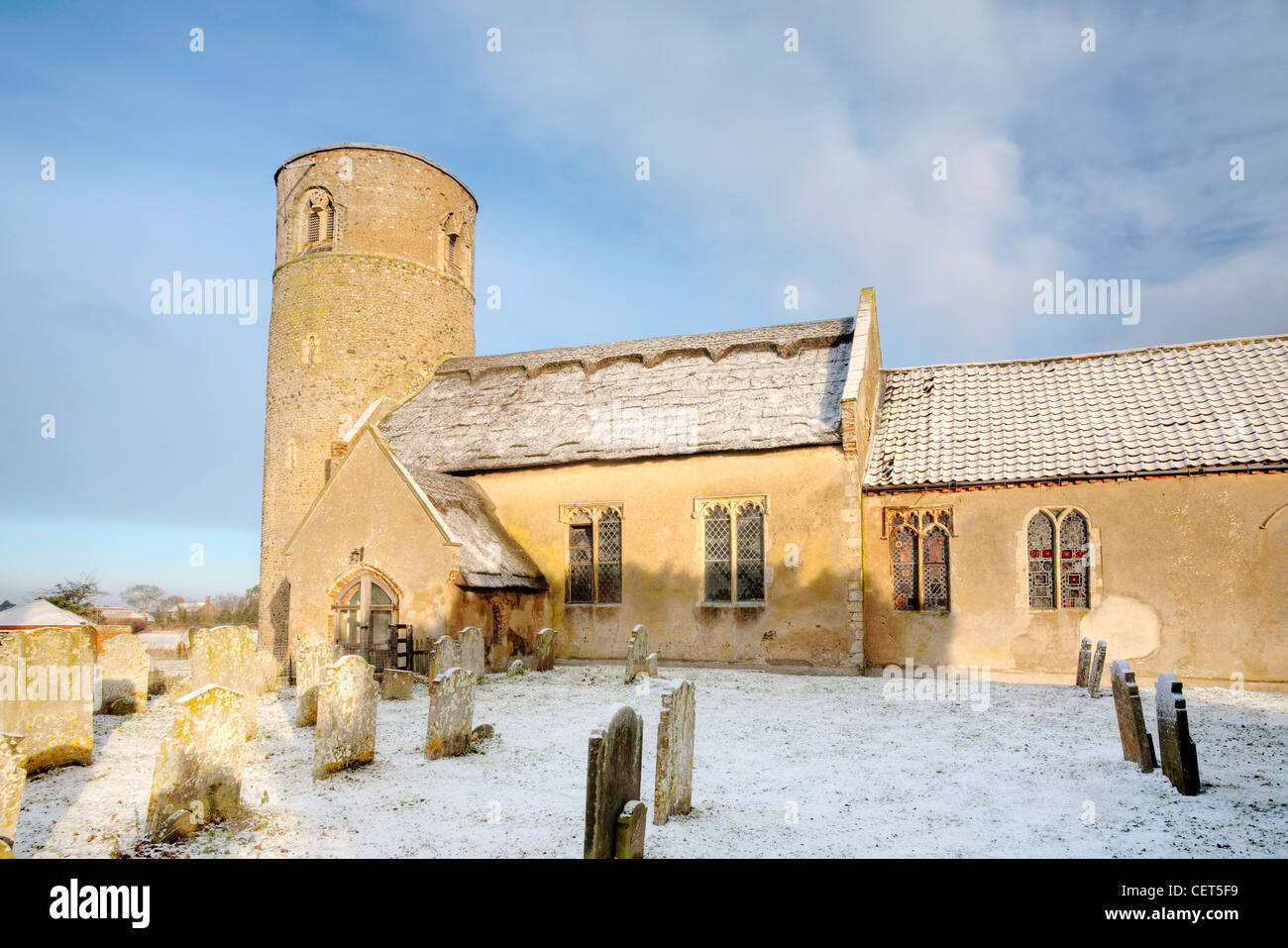Snow on and around the Norman church of Herringfleet St. Margaret. Stock Photo