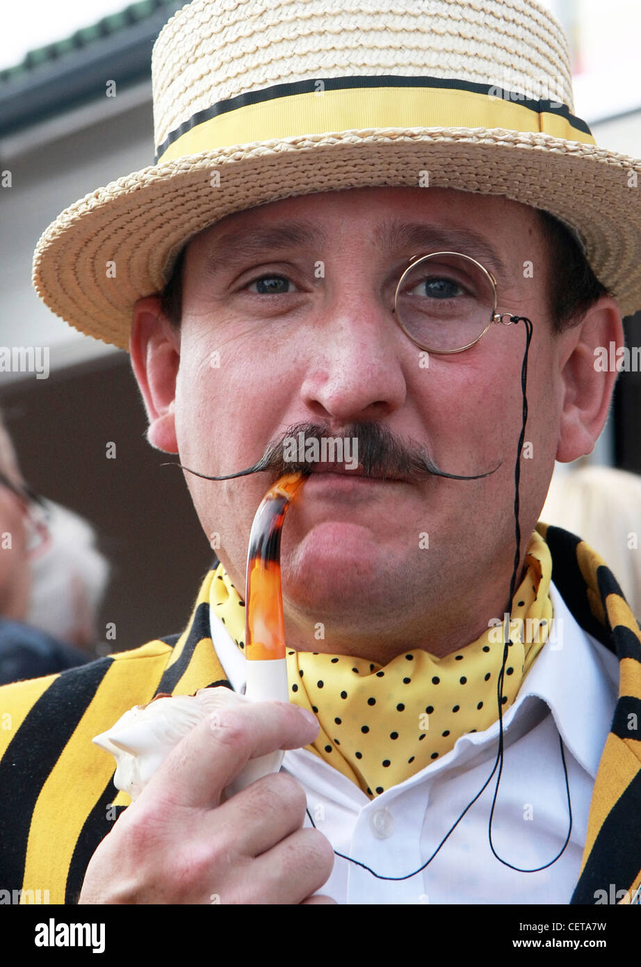 Close up of monocled man with pipe at Goodwood Revival. Stock Photo