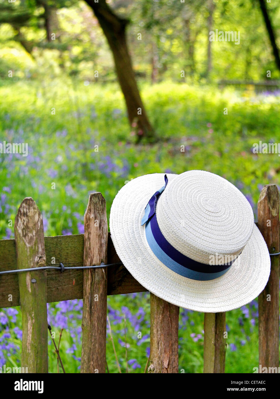 Schoolgirl's hat on a fence in Holland Park. Stock Photo
