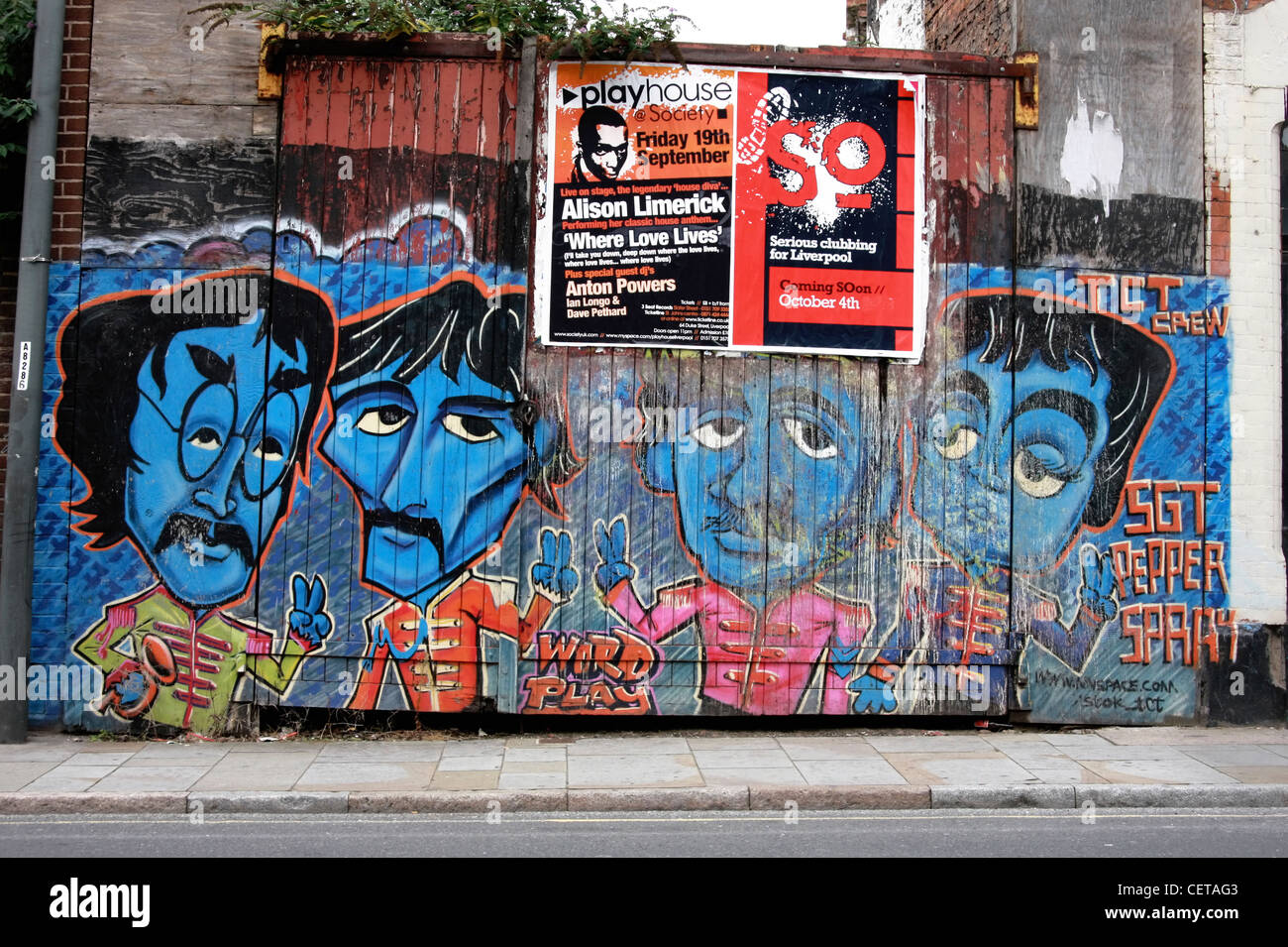 Graffiti on a gate in Liverpool featuring The Beatles. Stock Photo