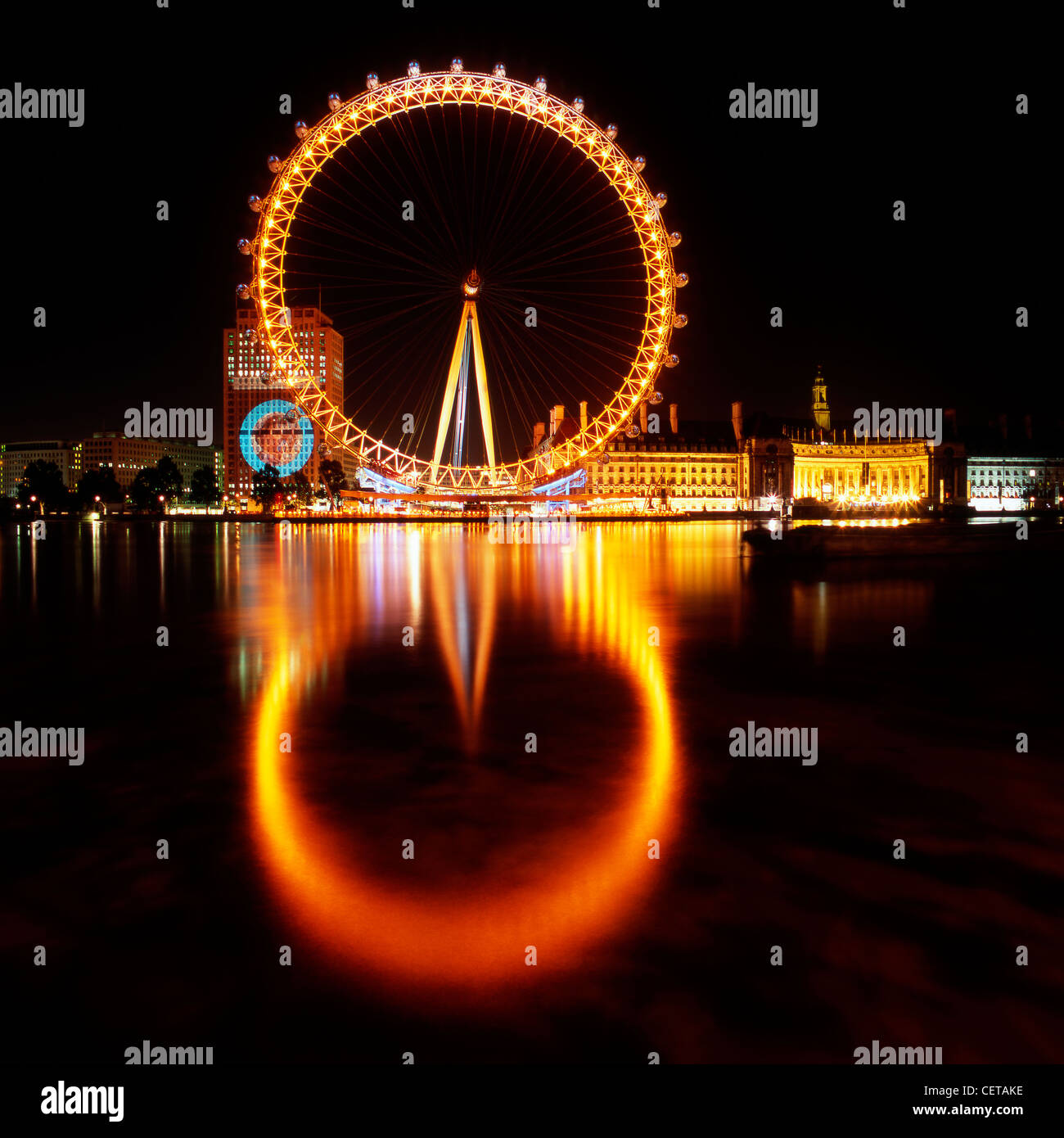 The British Airways London Eye at night. Opened in 1999, it stands at 135m tall making it the largest observation wheel in the w Stock Photo